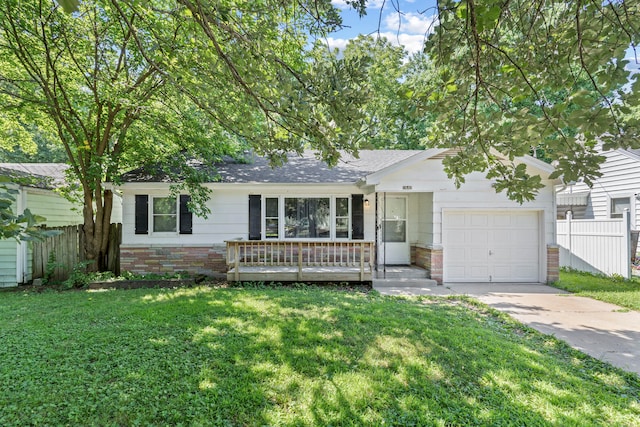 single story home with a garage and a front lawn