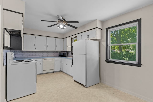 kitchen with ceiling fan, white appliances, white cabinets, and backsplash