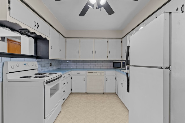 kitchen with ceiling fan, tasteful backsplash, white appliances, and white cabinetry