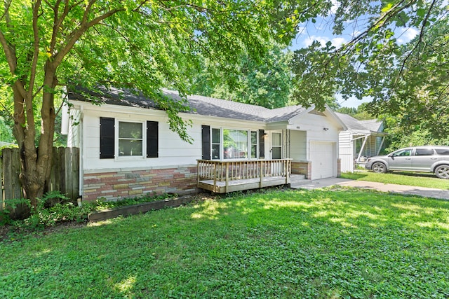 single story home featuring a garage and a front lawn