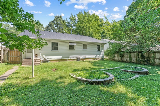 back of house with a yard