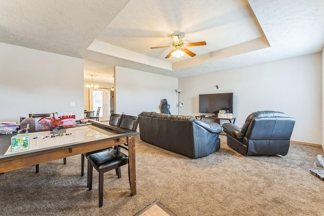 1130 S Arcadia Ave, Springfield, MO 65804 - living room with a raised ceiling, carpet, a textured ceiling, and ceiling fan with notable chandelier