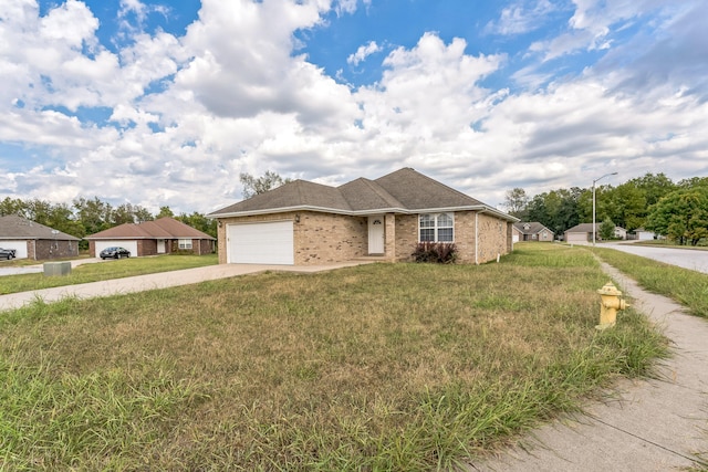 ranch-style house with a garage and a front lawn