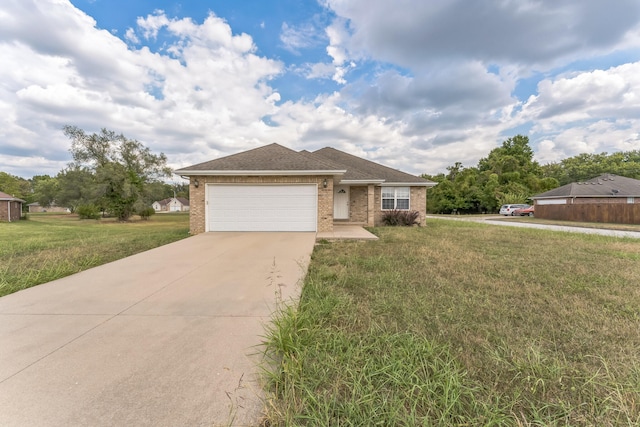 view of front of home with a garage and a front yard