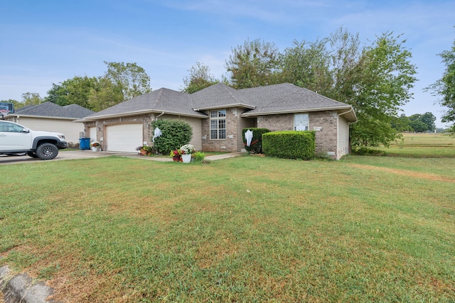 ranch-style home featuring a front lawn and a garage