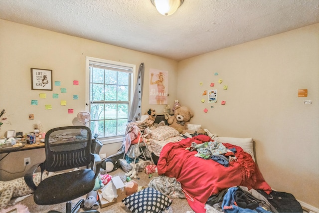 carpeted bedroom featuring a textured ceiling