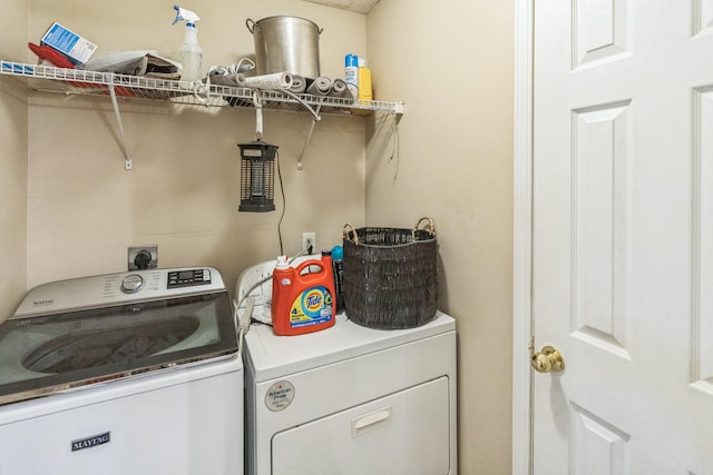 laundry room with independent washer and dryer