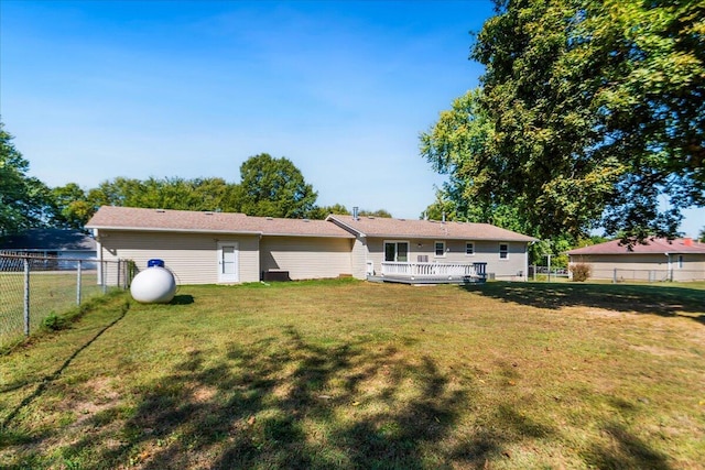 back of house featuring a yard