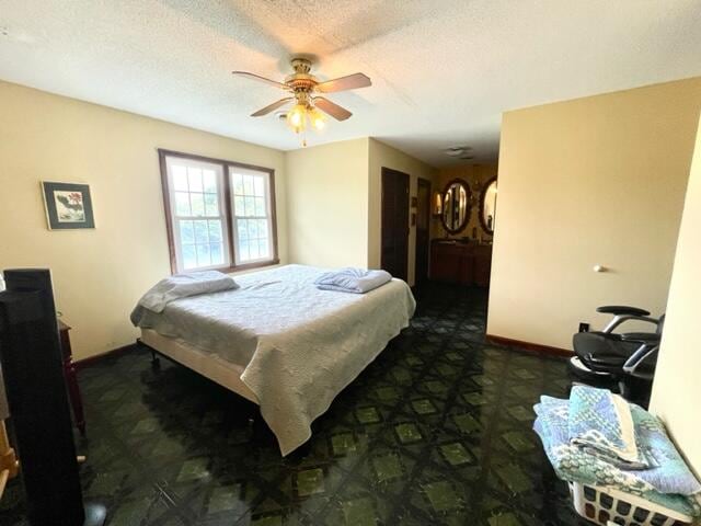 bedroom featuring a textured ceiling and ceiling fan