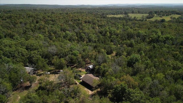 birds eye view of property with a view of trees