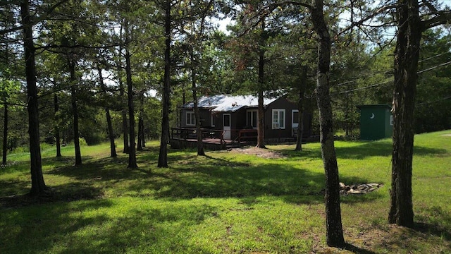 view of yard featuring a wooden deck