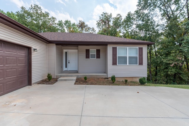 single story home with a garage