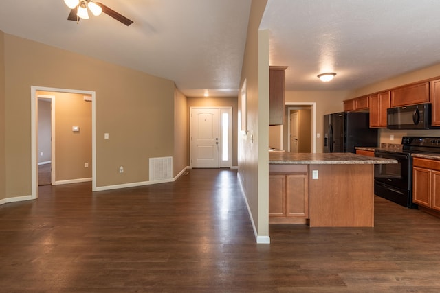 kitchen with black appliances, ceiling fan, dark hardwood / wood-style floors, and a textured ceiling