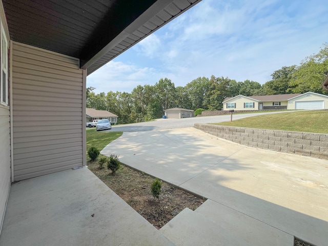 view of patio with a garage