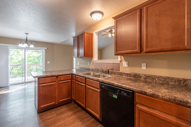 kitchen featuring hardwood / wood-style floors, sink, kitchen peninsula, black dishwasher, and a textured ceiling