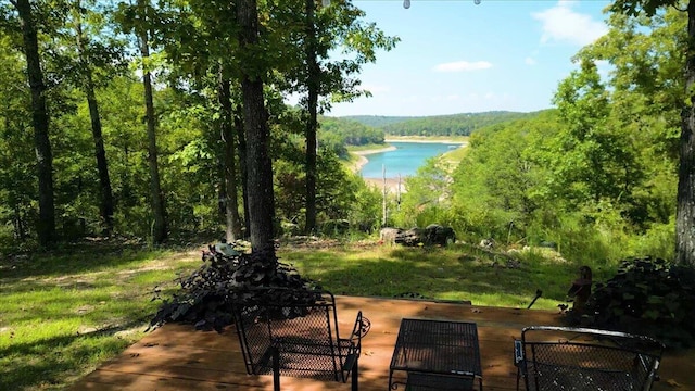 exterior space featuring a wooded view