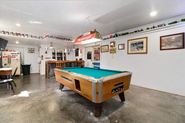 game room featuring concrete floors, a bar, pool table, and recessed lighting