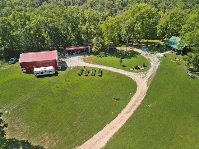 drone / aerial view featuring a forest view