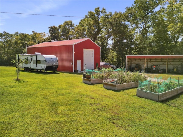 view of yard with an outdoor structure, an outbuilding, and a vegetable garden