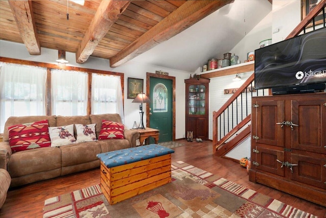 living room featuring stairway, lofted ceiling with beams, wooden ceiling, and wood finished floors