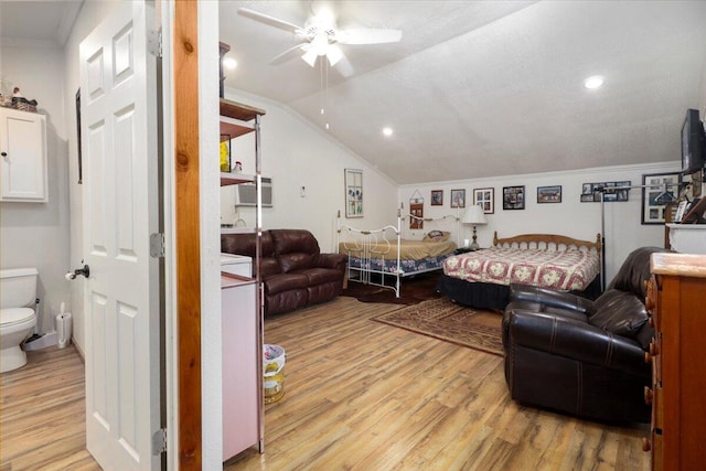 bedroom featuring lofted ceiling, crown molding, ceiling fan, and light hardwood / wood-style flooring