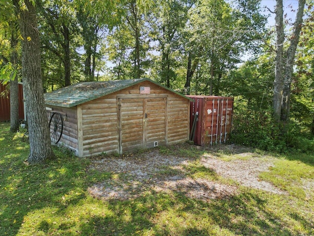 view of shed with fence