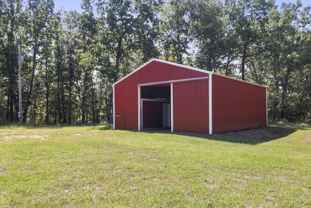 view of pole building with a yard