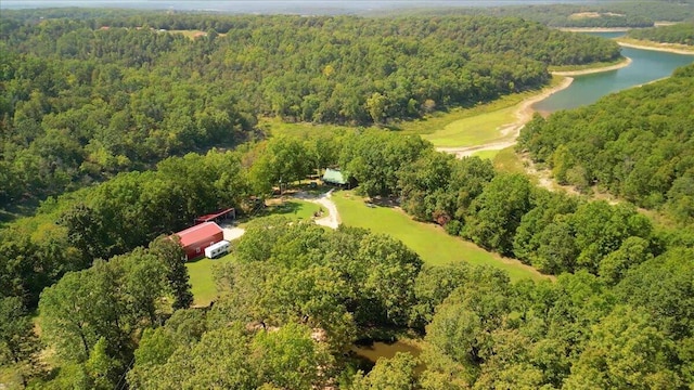 bird's eye view featuring a view of trees and a water view
