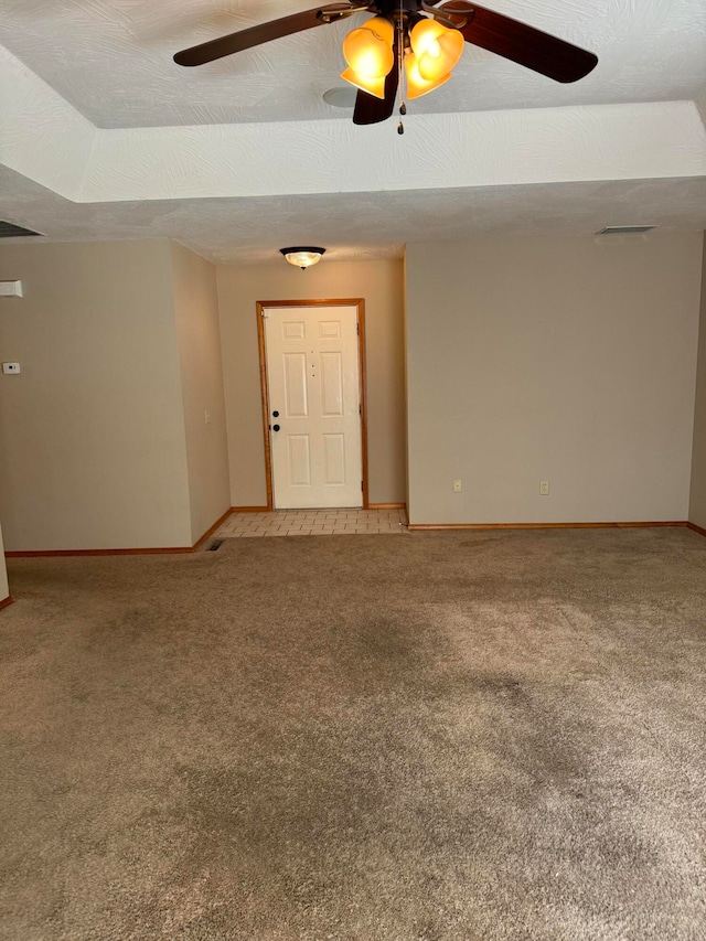 spare room with carpet floors and a textured ceiling