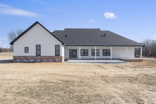 rear view of property featuring a patio area