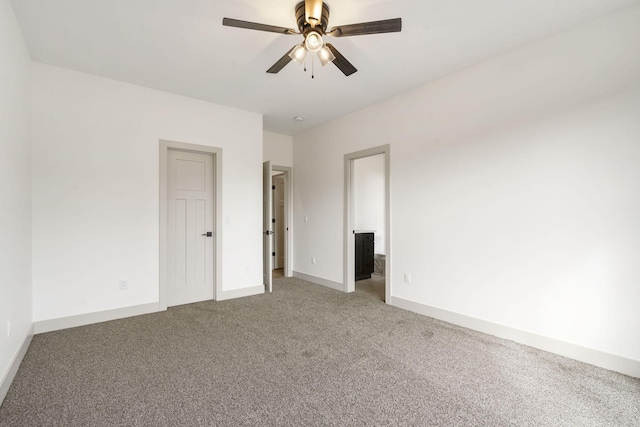 unfurnished room featuring light carpet, ceiling fan, and baseboards