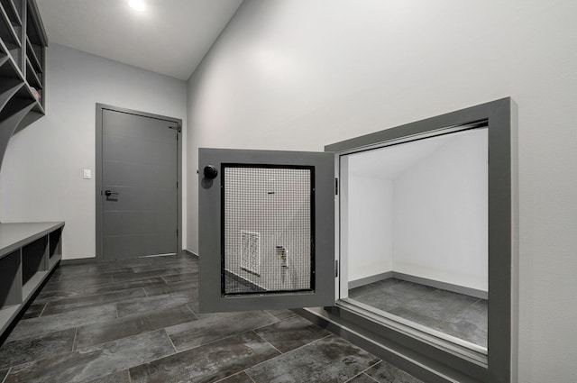 interior space featuring lofted ceiling and vanity