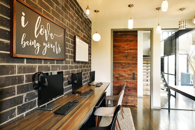 office featuring brick wall and dark wood-type flooring