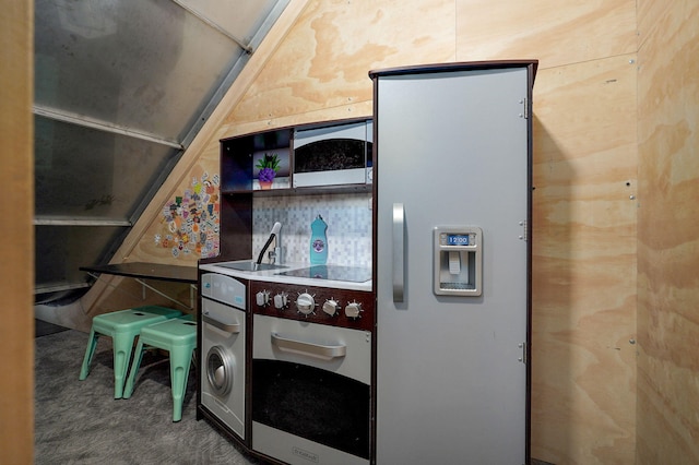 kitchen with wall oven, carpet flooring, and black electric stovetop