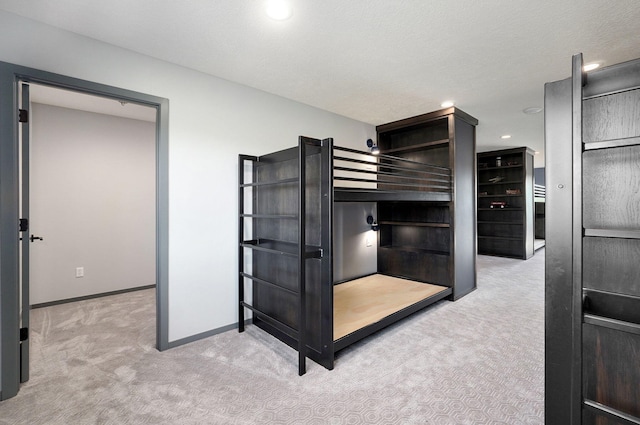 carpeted bedroom featuring a textured ceiling