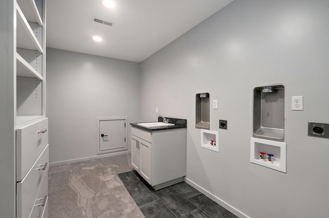 laundry room with hookup for a washing machine, cabinets, dark colored carpet, and electric dryer hookup