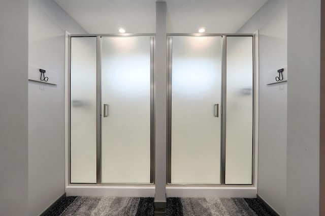 bathroom featuring an enclosed shower