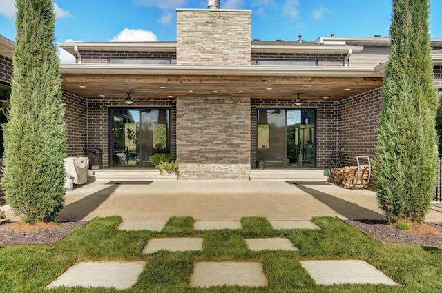 back of house featuring a patio and ceiling fan