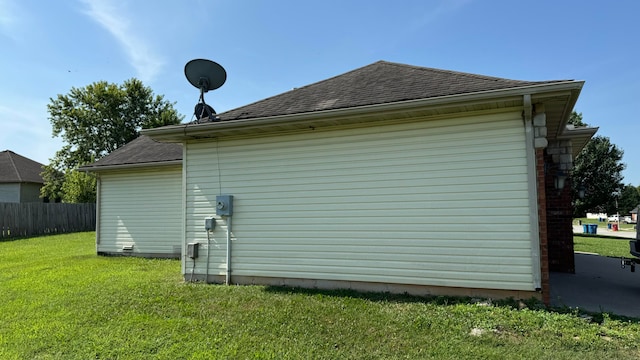 view of property exterior with a lawn