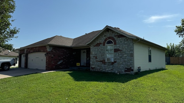 ranch-style house featuring cooling unit, a garage, and a front lawn