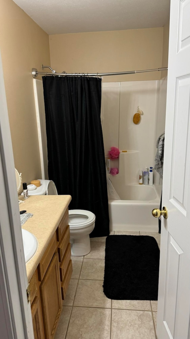 full bathroom with vanity, tile patterned flooring, toilet, and shower / bath combo