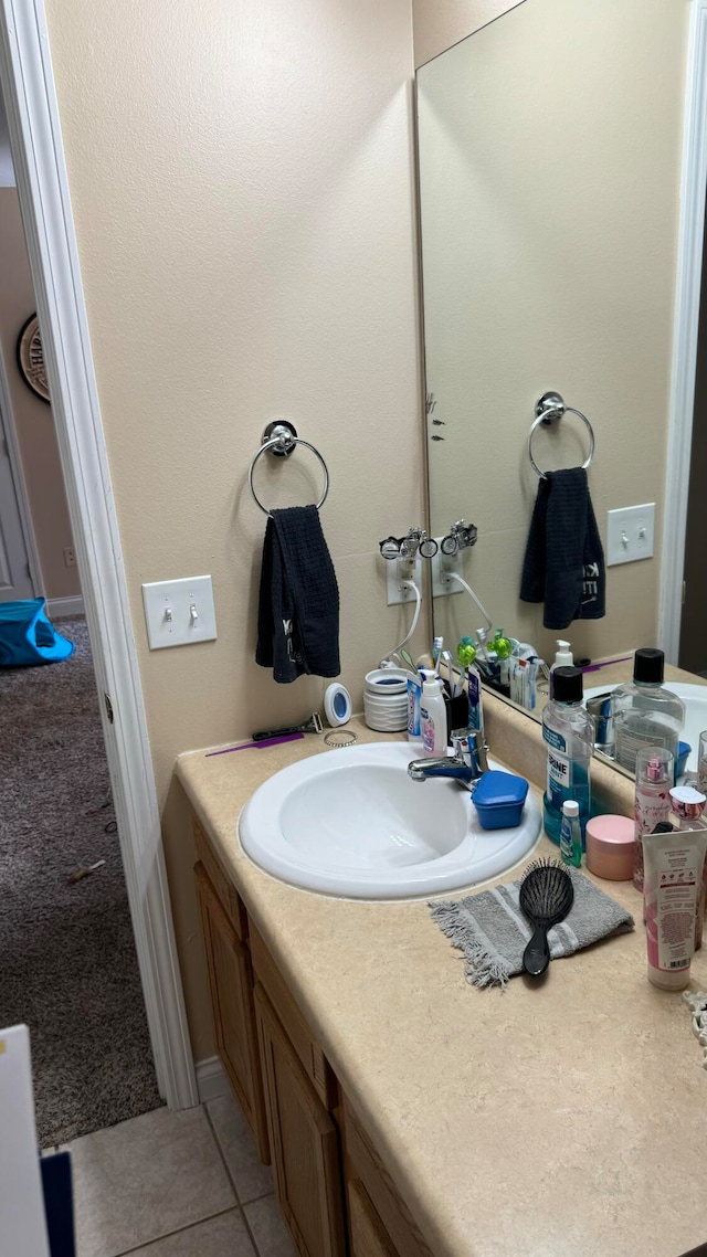 bathroom featuring tile patterned floors and vanity