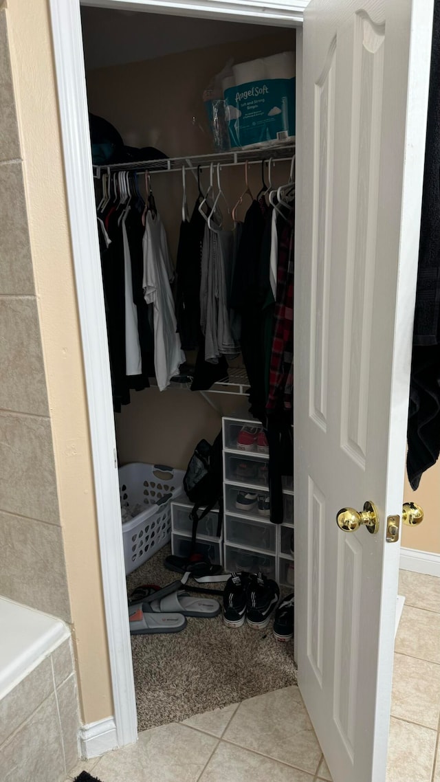 spacious closet featuring light tile patterned flooring