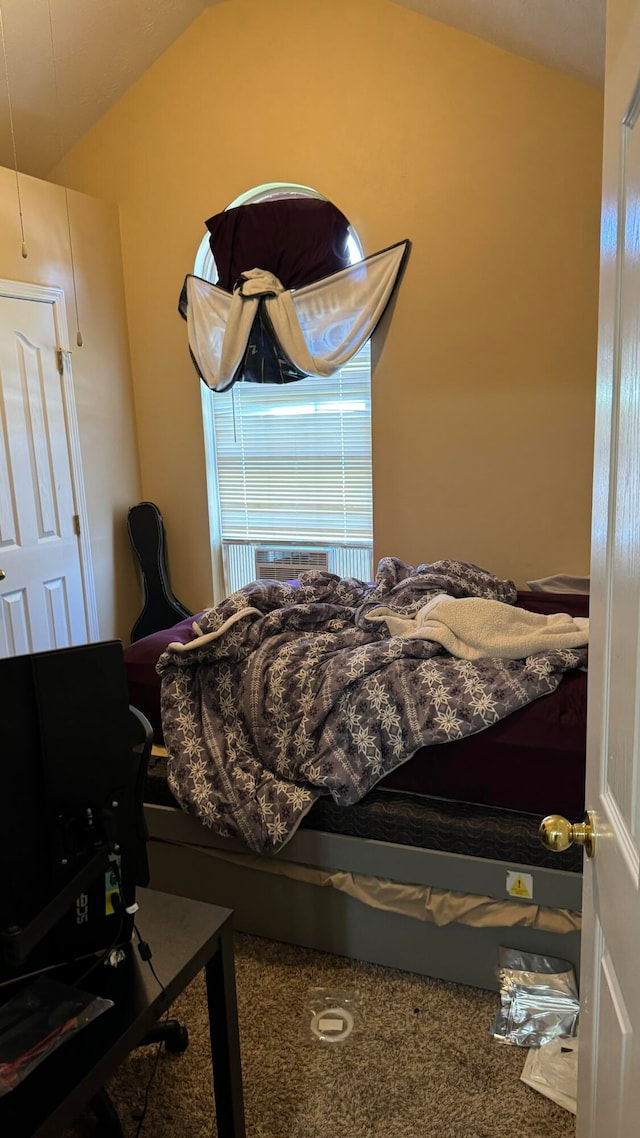 carpeted bedroom featuring vaulted ceiling