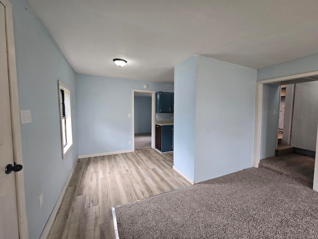 spare room with hardwood / wood-style floors