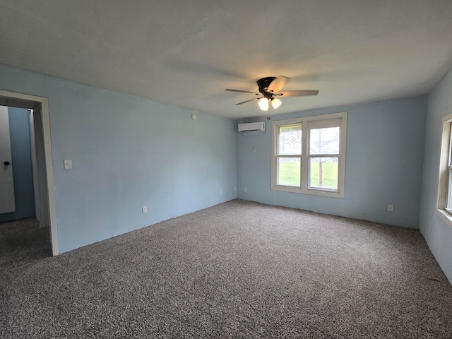 empty room featuring ceiling fan, a wall mounted air conditioner, and carpet