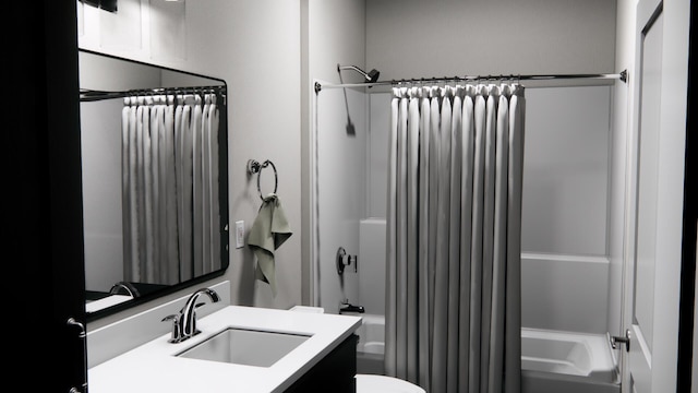 full bath featuring shower / tub combo with curtain, toilet, and vanity