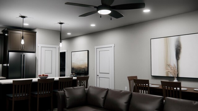 living area with recessed lighting and a ceiling fan