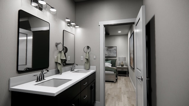 bathroom with hardwood / wood-style flooring and vanity