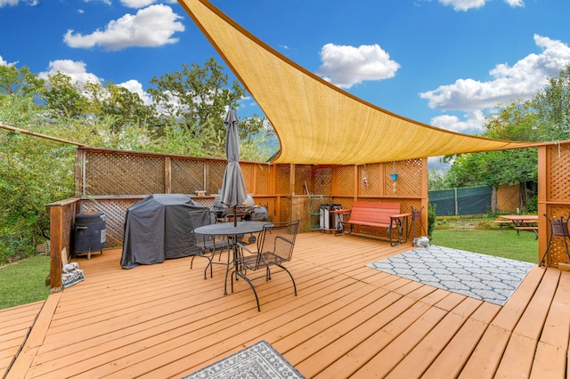 wooden deck featuring area for grilling